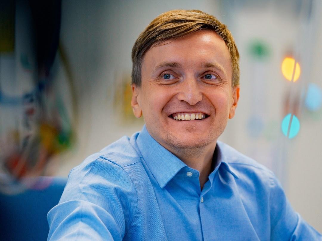 Close up of Adam Strzelecki smiling.