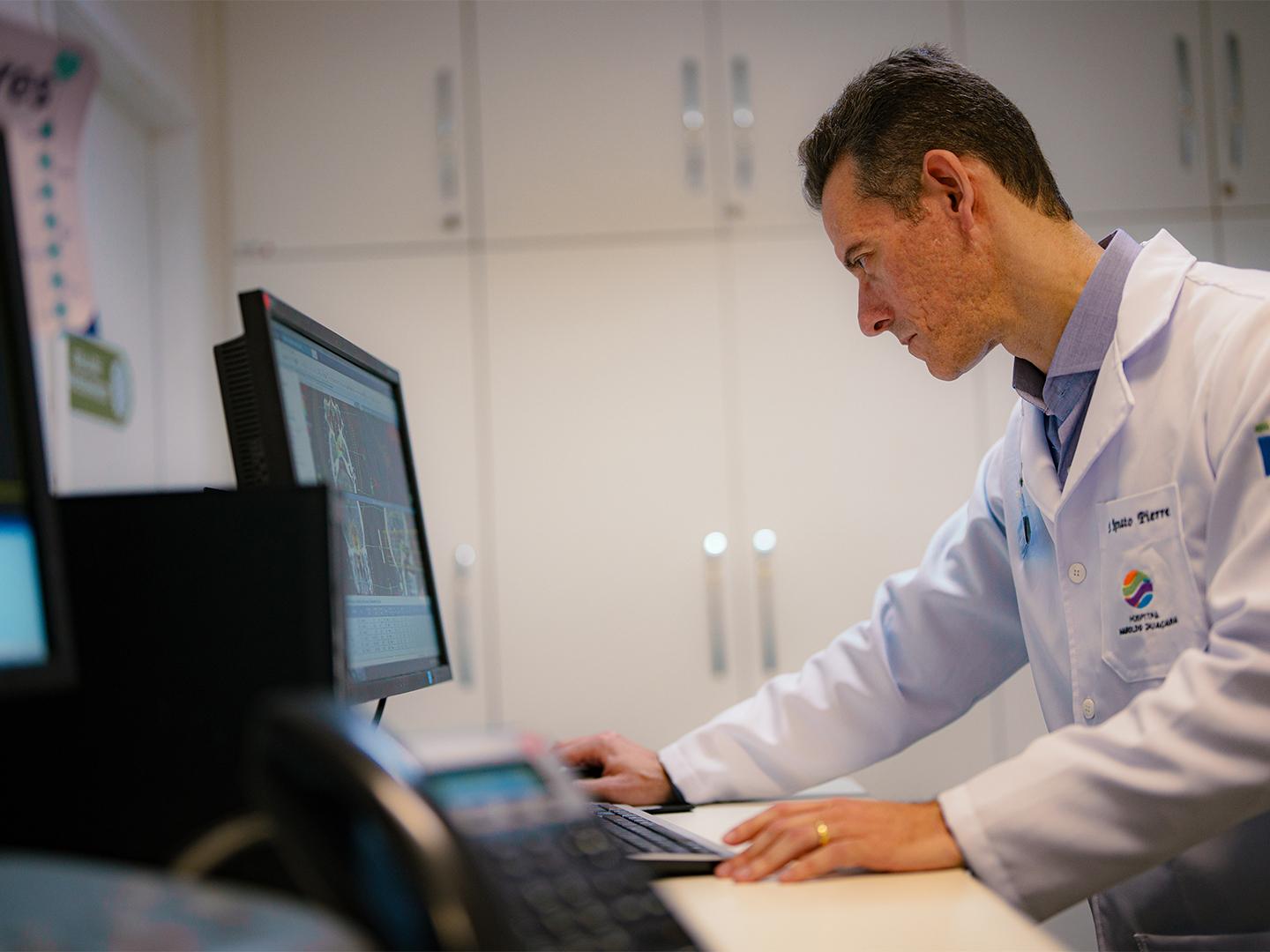 Renato Pierre, MD, looking at clinical image