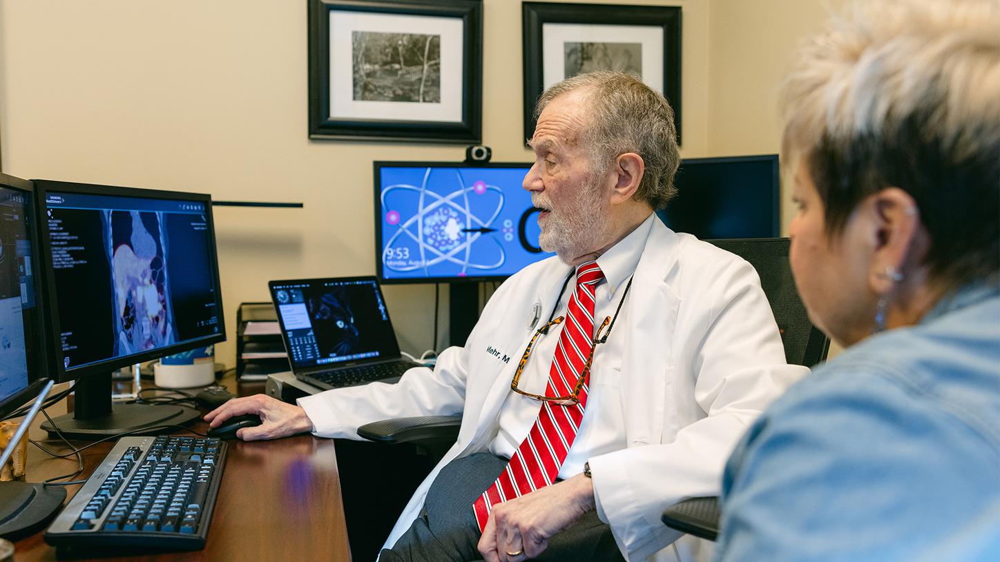 Samuel Mehr, MD, director of Nuclear Oncology at NCS, and Glenda discuss results of the theranostics treatment.